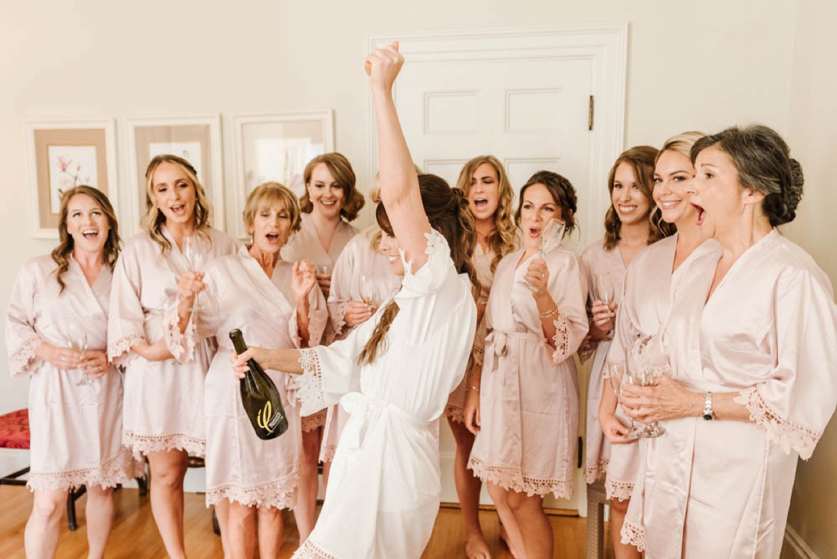 Garden Inspired Summer Wedding at Glen Magna Farms in Danvers, Massachusetts by Boston Wedding Photographer Annmarie Swift - Bride & bridesmaids celebrate with champagne
