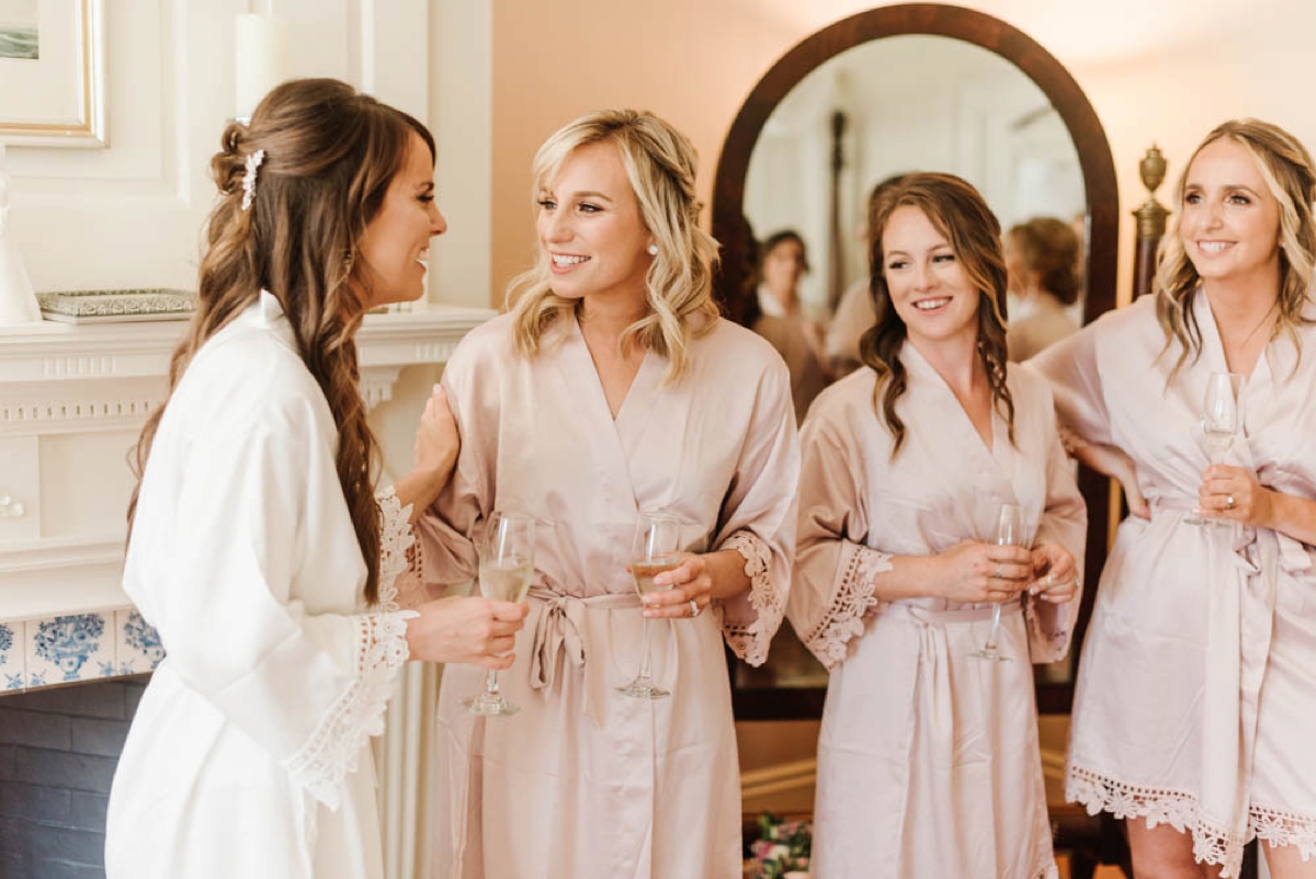Garden Inspired Summer Wedding at Glen Magna Farms in Danvers, Massachusetts by Boston Wedding Photographer Annmarie Swift - Bride & bridesmaids celebrate with champagne
