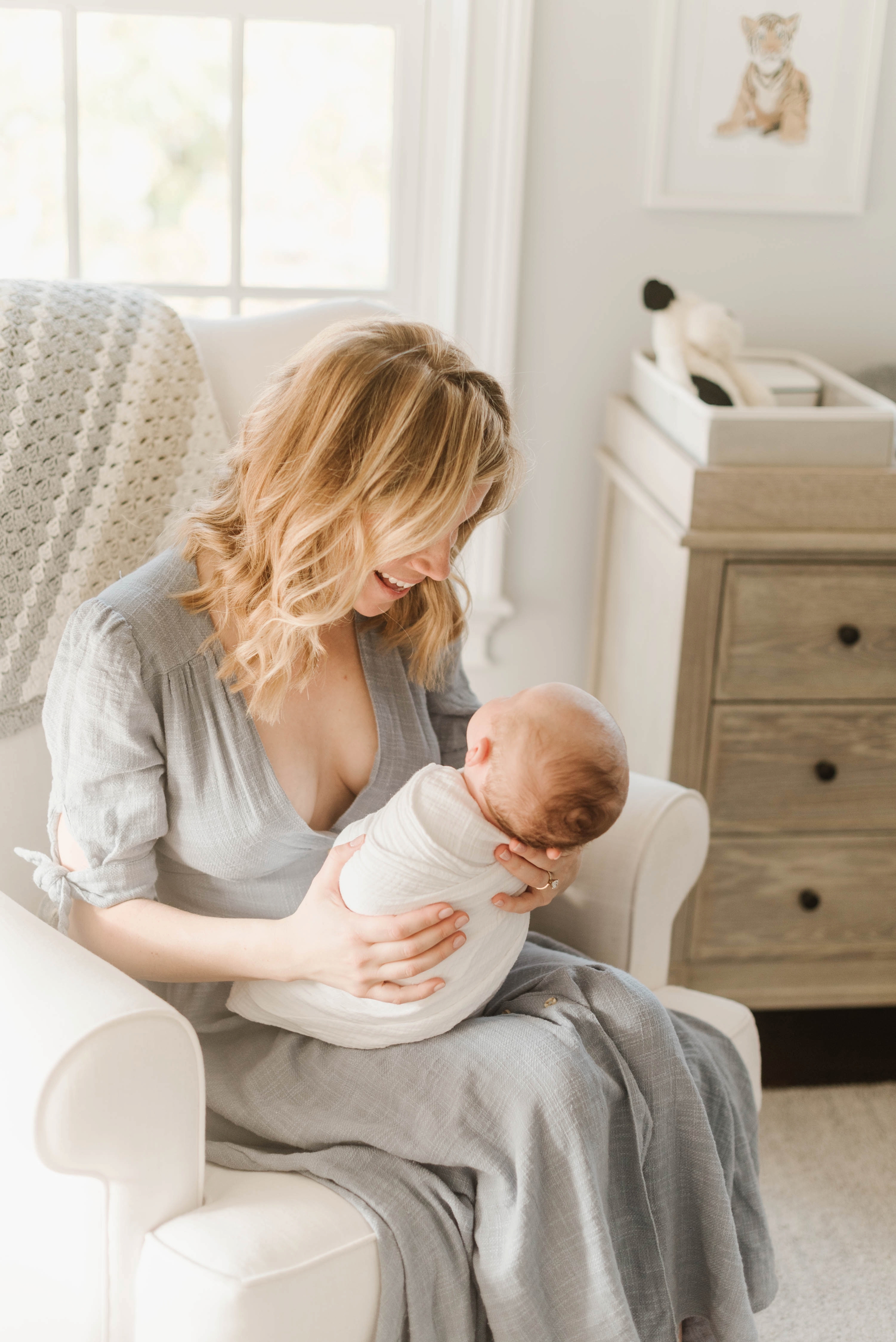 This lifestyle newborn session features rich neutral tones & intimate family & motherhood photos photographed by Boston Newborn Photographer Annmarie Swift