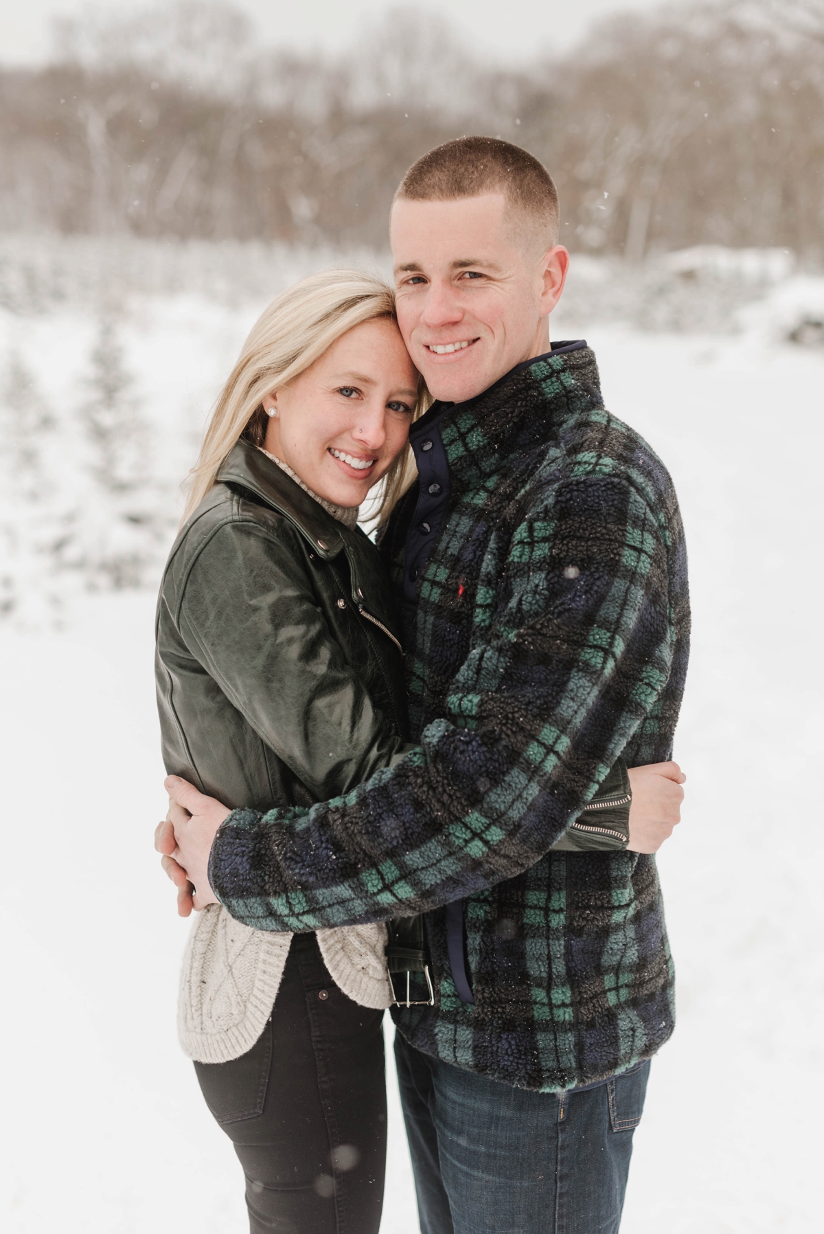 This tree farm engagement session at Holiday Tree Farm in Topsfield, Massachusetts by Boston Wedding Photographer Annmarie Swift